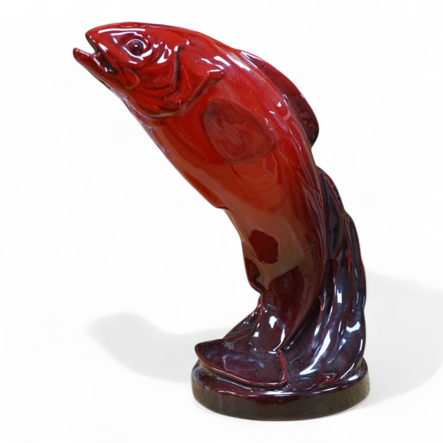 A Royal Doulton leaping salmon in flambe glaze, 31cm